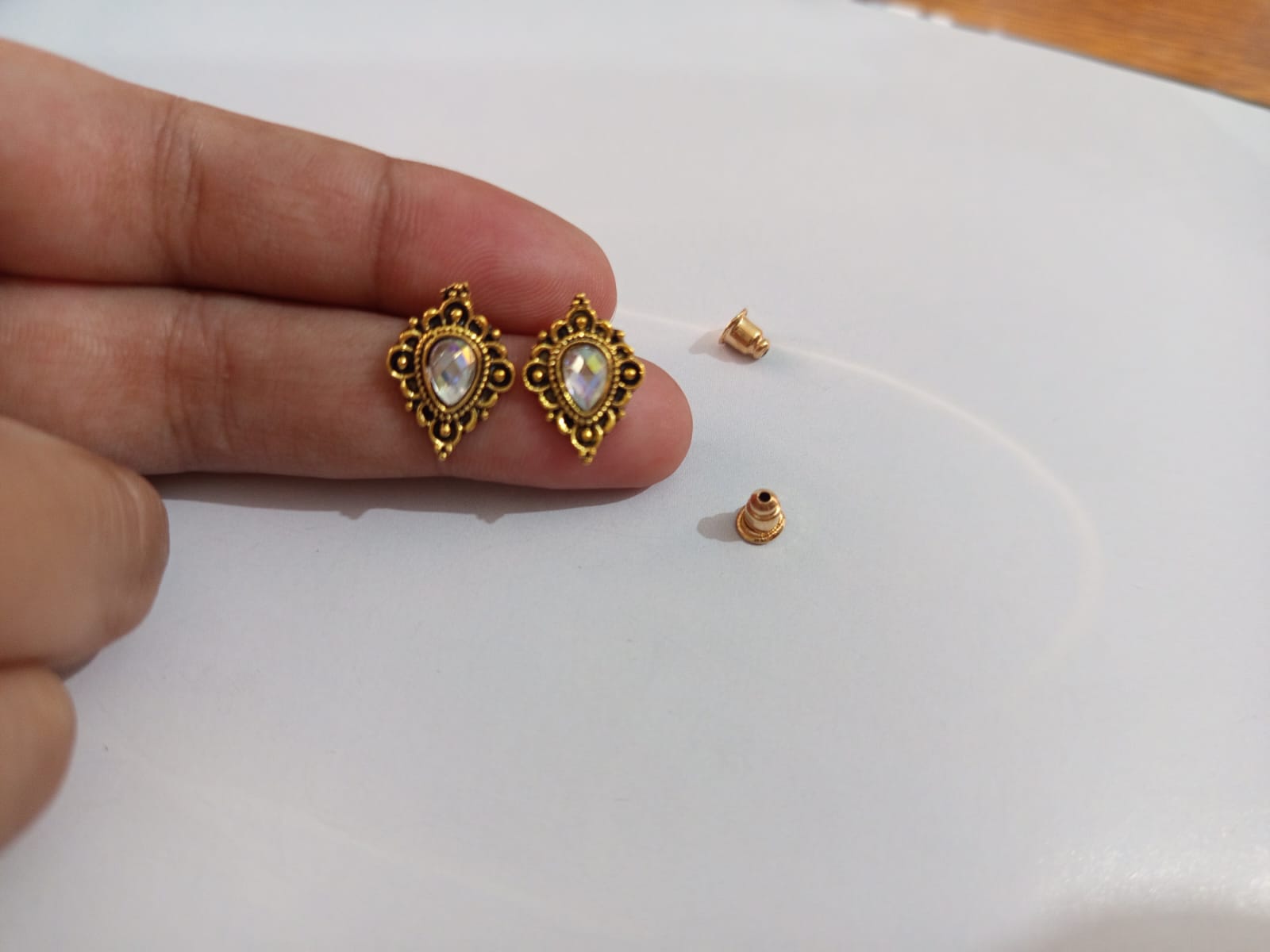 Golden studs with heart shape stones
