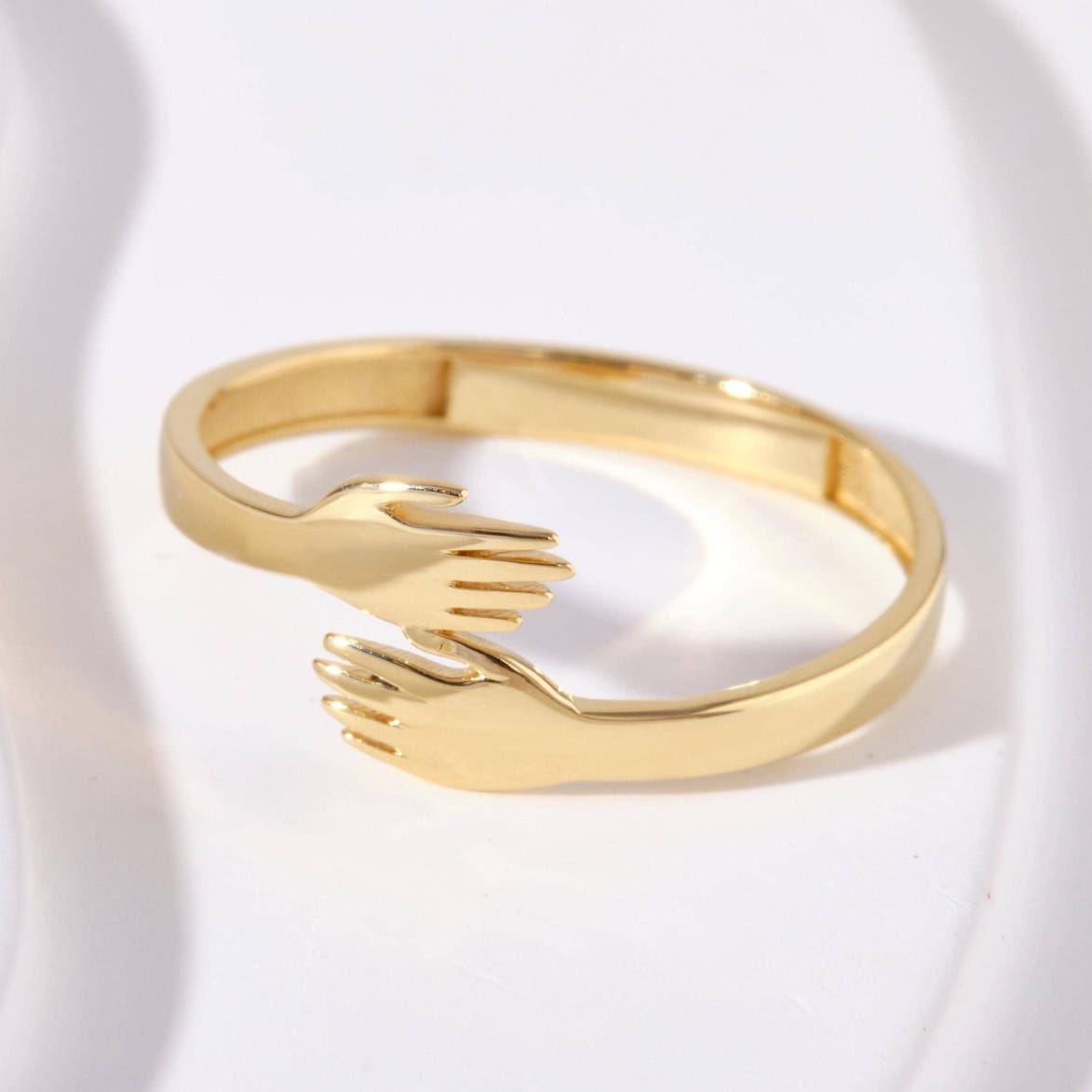 Two-Piece Women's Jewelry Set Featuring a Design of Hands Holding Each Other